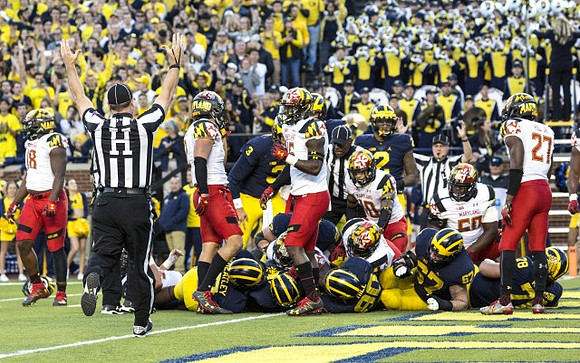Tyrone Wheatley Jr. (17), Khalid Hill (80), Kyle Kalis (67), Erik Magnuson (78), Wilton Speight (3), and Devin Asiasi (2)