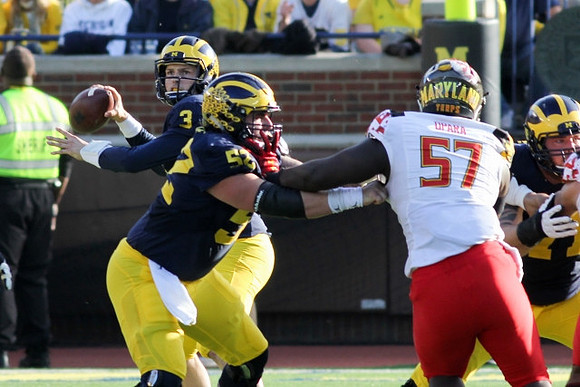 Wilton Speight (3) and Mason Cole (52)
