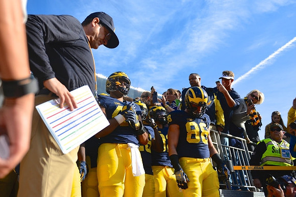 Jim Harbaugh, Chris Wormley (43), and Jake Butt (88)