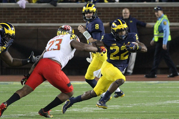 John O'Korn (8) and Karan Higdon (22)