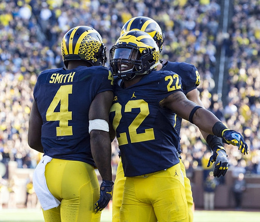 De'Veon Smith (4), Karan Higdon (22), and John O'Korn (8)