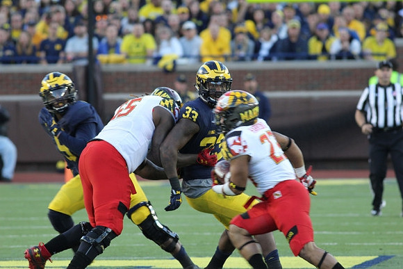 Mike McCray (9) and Taco Charlton (33)