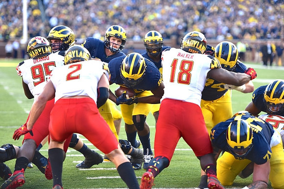 Mason Cole (52), Wilton Speight (3), Khalid Hill (80), De'Veon Smith (4), and Ben Bredeson (74)