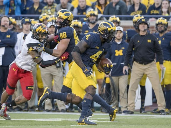 Jake Butt (88), De'Veon Smith (4), and Jim Harbaugh