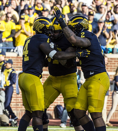De'Veon Smith (4), Kyle Kalis (67), and Devin Asiasi (2)