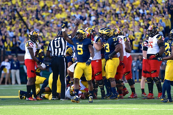 Jabrill Peppers (5) and Maurice Hurst (73)