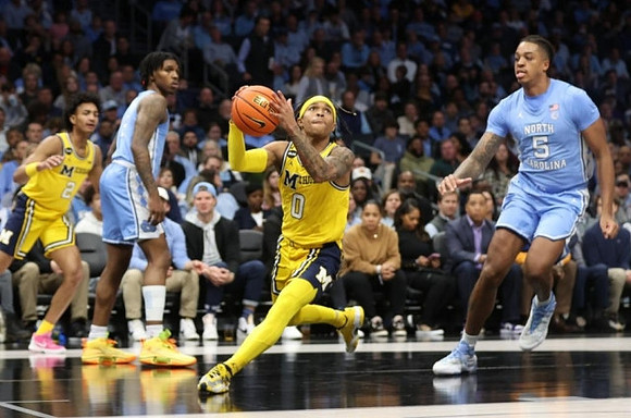 Kobe Bufkin (2) and Dug McDaniel (0)