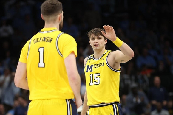 Hunter Dickinson (1) and Joey Baker (15)