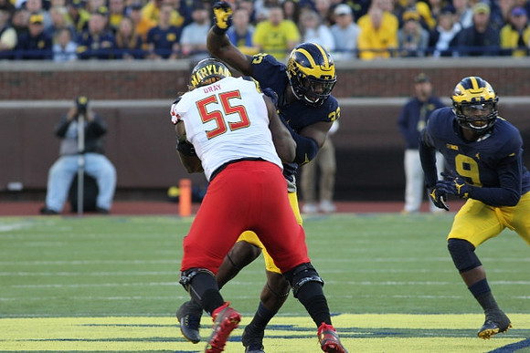 Taco Charlton (33) and Mike McCray (9)