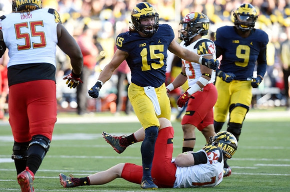 Chase Winovich (15) and Mike McCray (9)