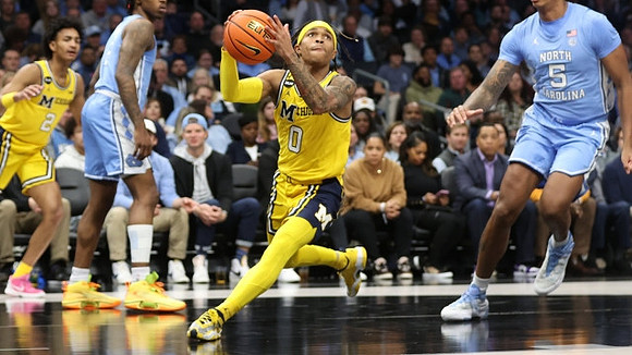 Kobe Bufkin (2) and Dug McDaniel (0)