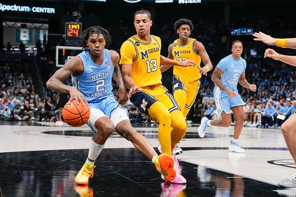 Jett Howard (13) and Tarris Reed Jr. (32)
