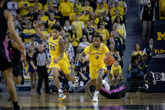 Eli Brooks (55) and Zavier Simpson (3)