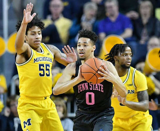 Eli Brooks (55) and Zavier Simpson (3)