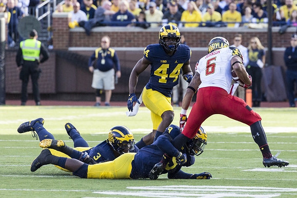 Rashan Gary (3), Mike McCray (9), and Delano Hill (44)