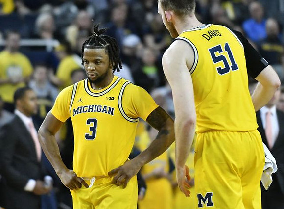 Zavier Simpson (3) and Austin Davis (51)