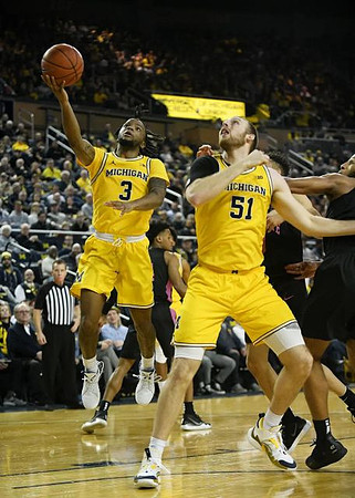 Zavier Simpson (3) and Austin Davis (51)