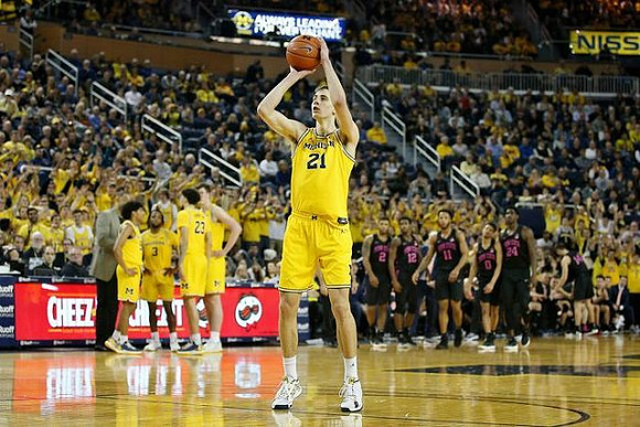 Franz Wagner (21), Eli Brooks (55), Zavier Simpson (3), Brandon Johns Jr. (23), and Jon Teske (15)