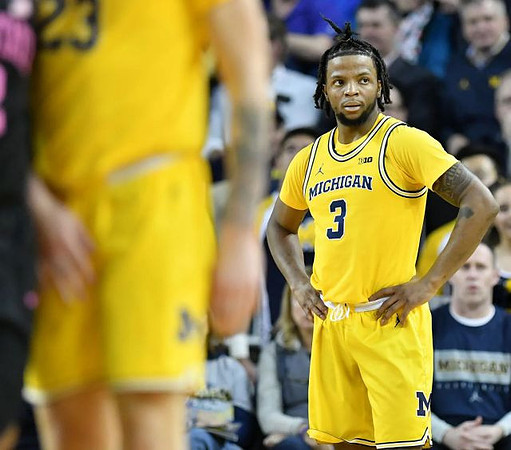 Zavier Simpson (3) and Brandon Johns Jr. (23)
