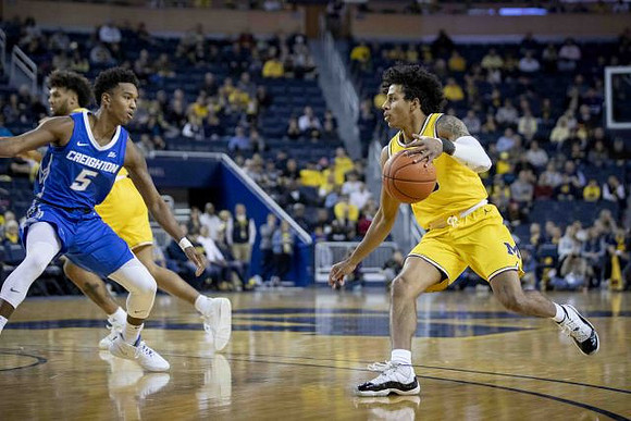 David DeJulius (0) and Eli Brooks (55)