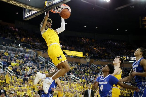 Isaiah Livers (2) and Colin Castleton (11)