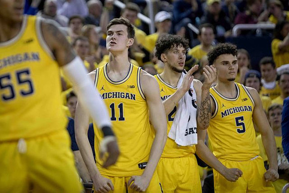 Eli Brooks (55), Colin Castleton (11), Brandon Johns Jr. (23), and Adrien Nunez (5)
