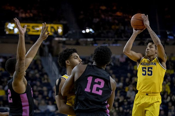 David DeJulius (0) and Eli Brooks (55)