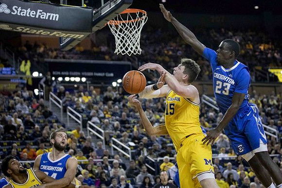 David DeJulius (0) and Jon Teske (15)