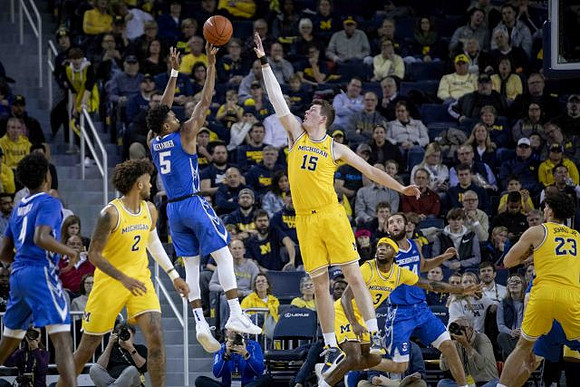 Isaiah Livers (2), Jon Teske (15), and Brandon Johns Jr. (23)
