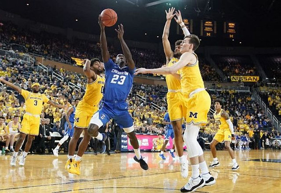 Zavier Simpson (3), David DeJulius (0), Isaiah Livers (2), Colin Castleton (11), and Eli Brooks (55)