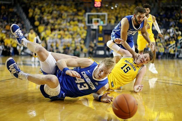 Jon Teske (15) and Isaiah Livers (2)