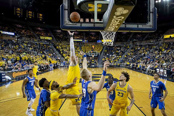 Isaiah Livers (2), Zavier Simpson (3), Jon Teske (15), and Brandon Johns Jr. (23)