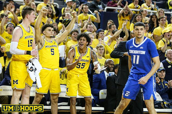 Jon Teske (15), Adrien Nunez (5), and Eli Brooks (55)