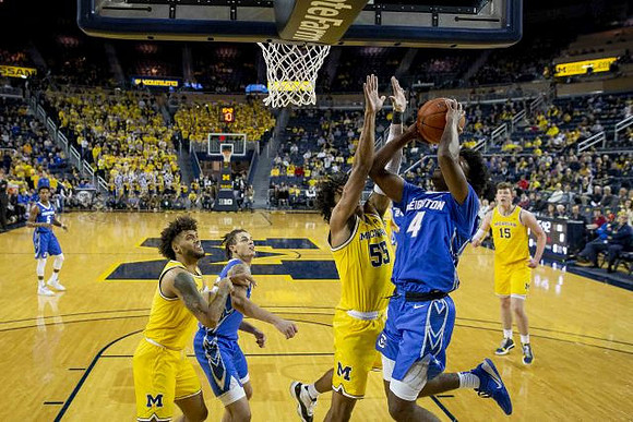 Isaiah Livers (2), Eli Brooks (55), and Jon Teske (15)