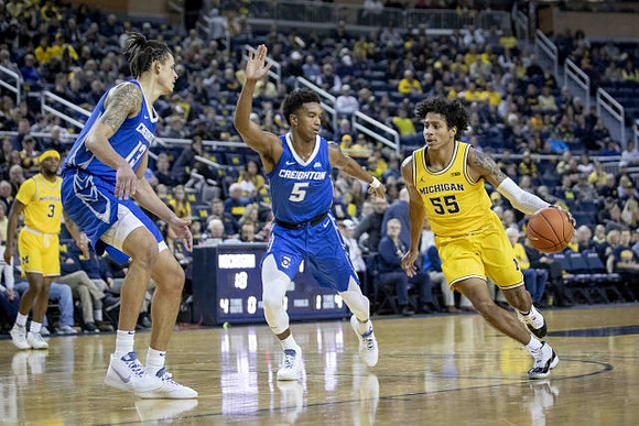 Zavier Simpson (3) and Eli Brooks (55)
