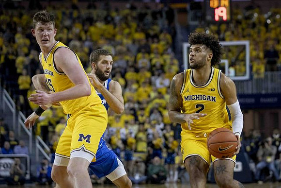 Jon Teske (15) and Isaiah Livers (2)