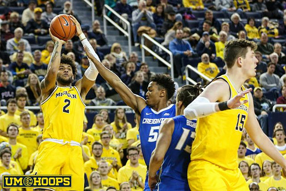 Isaiah Livers (2) and Jon Teske (15)