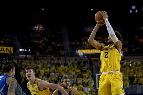 Jon Teske (15) and Isaiah Livers (2)