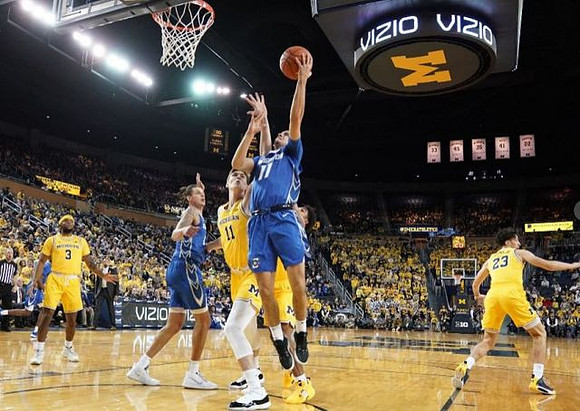 Zavier Simpson (3), Colin Castleton (11), Eli Brooks (55), and Brandon Johns Jr. (23)