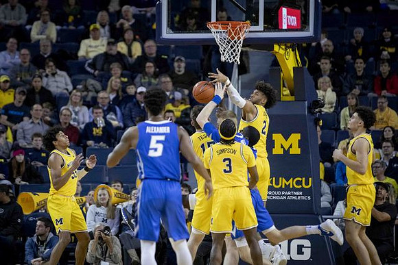 Eli Brooks (55), Jon Teske (15), Zavier Simpson (3), Isaiah Livers (2), and Adrien Nunez (5)