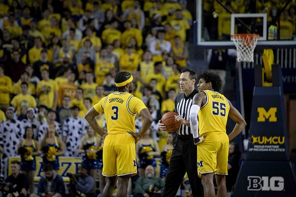 Zavier Simpson (3) and Eli Brooks (55)