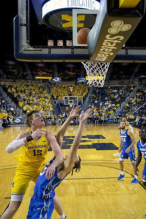 Jon Teske (15) and Isaiah Livers (2)
