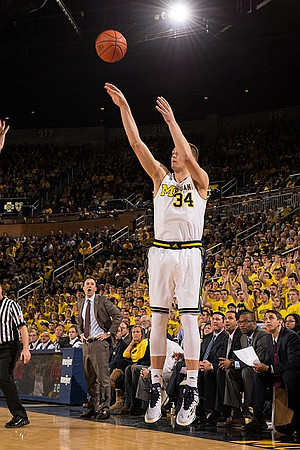 Mark Donnal (34) and Minnesota Head Coach Richard Pitino