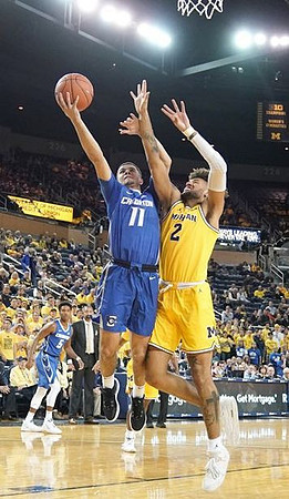 Isaiah Livers (2) and Juwan Howard