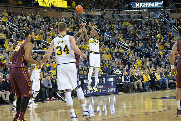 Derrick Walton Jr. (10), Mark Donnal (34), and Aubrey Dawkins (24)