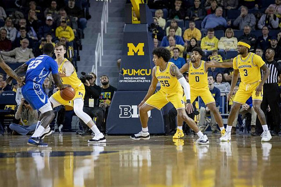 Colin Castleton (11), Eli Brooks (55), David DeJulius (0), and Zavier Simpson (3)