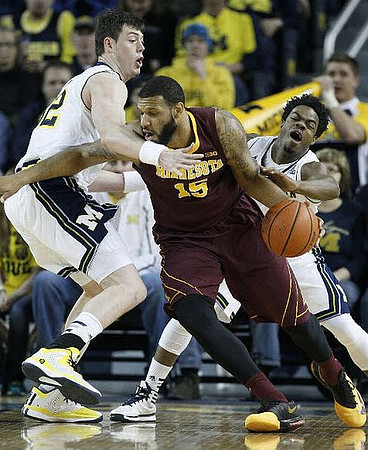 Ricky Doyle (32) and Derrick Walton Jr. (10)