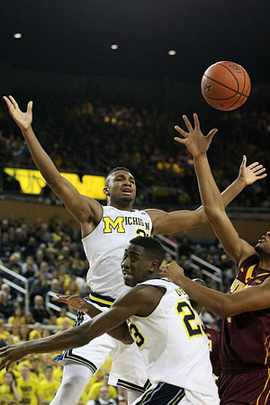 Zak Irvin (21) and Caris LeVert (23)