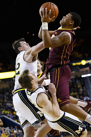 Caris LeVert (23) and Spike Albrecht (2)