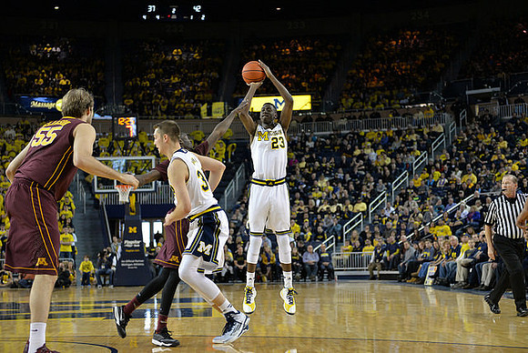 Mark Donnal (34) and Caris LeVert (23)